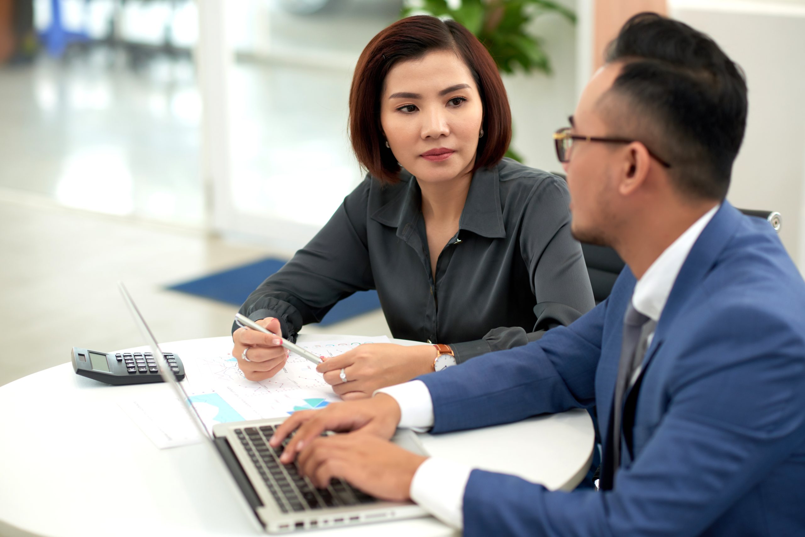 Couple consulting on Long-Term Visit Pass and Dependant Pass options in Singapore.
