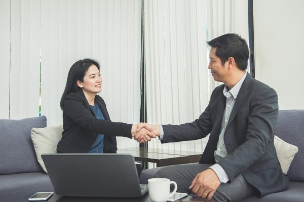 Work Pass application consultation between immigration specialist and client.